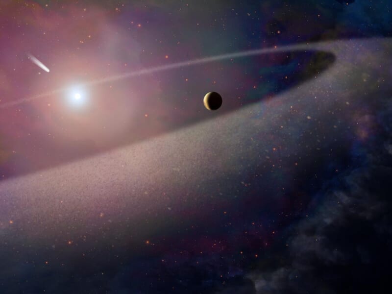 白色矮星に向かって落ちていく、彗星のような巨大な天体を描いた想像図です。今回の研究とは別に、ハッブル宇宙望遠鏡を使った観測で、ハレー彗星に似た成分をもちながら10万倍も重い天体が、白色矮星の大気の中で引き裂かれて散らばる様子がとらえられました。